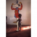 An-emaciated-child-stands-in-front-of-a-drawing-of-Goofy-in-Biafra-a-secessionist-state-in-southern-Nigeria-circa-1970